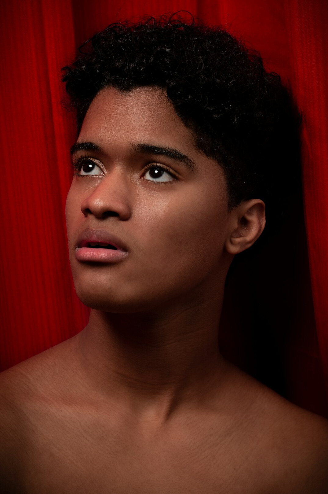 Studio portrait of a young man with short dark hair